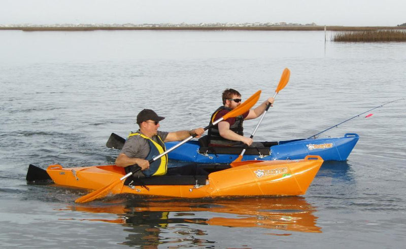 two guys in a fishing kayak