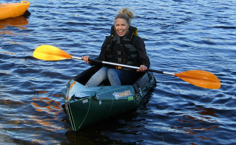 sitting in a folding boat